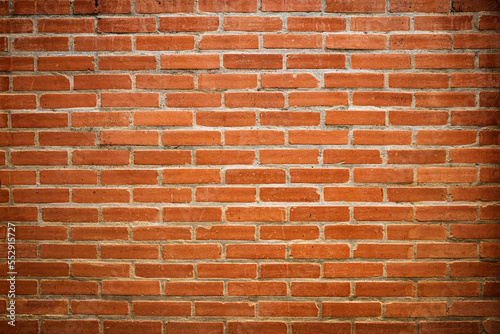 abstract background of a neatly arranged orange brick wall.