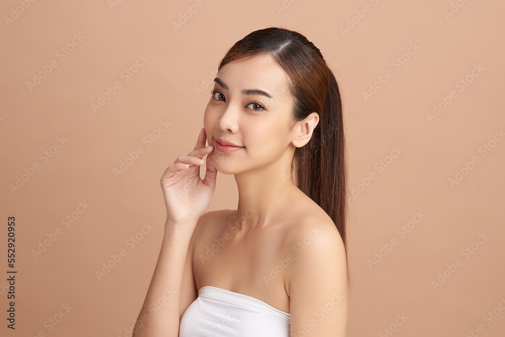 Beautiful young asian woman with clean fresh skin on beige background, Face care, Facial treatment, Cosmetology, beauty and spa, Asian women portrait. Beautiful young asian woman with clean fresh skin on beige background, Face care, Facial treatment, Cosmetology, beauty and spa, Asian women portrait.