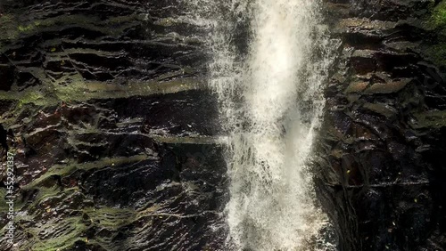 Slow motion shot of a waterfall from above photo