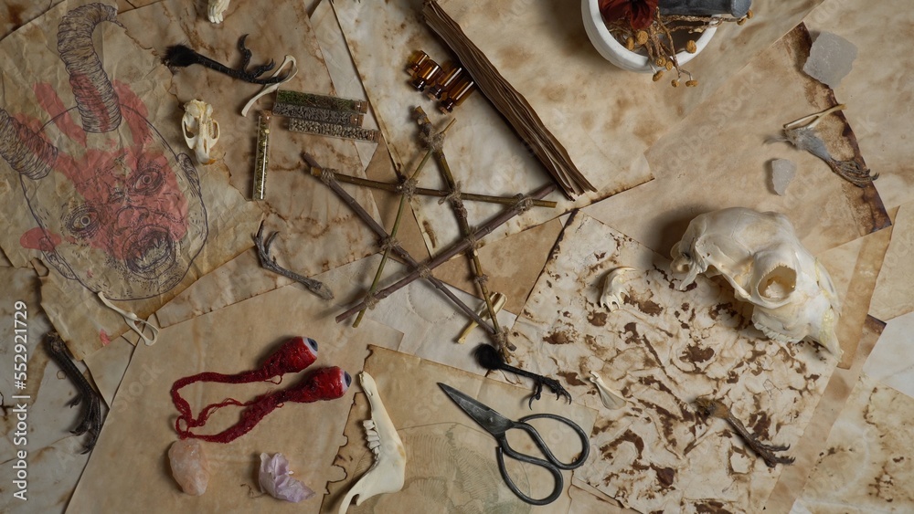 Mystic occult background with witch craft tools and ingredients on old ...