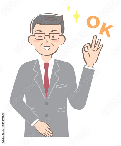 OKサインを出すスーツ姿のシニア男性