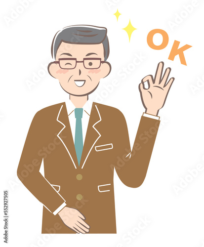 OKサインを出すスーツ姿のシニア男性