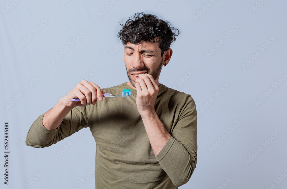 Person with gingivitis holding toothbrush. People holding toothbrush