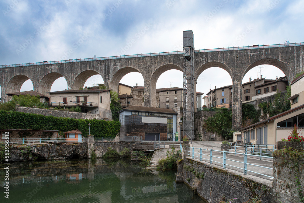 Old stone aqueduct in the town of Saint Nazaire en Royans