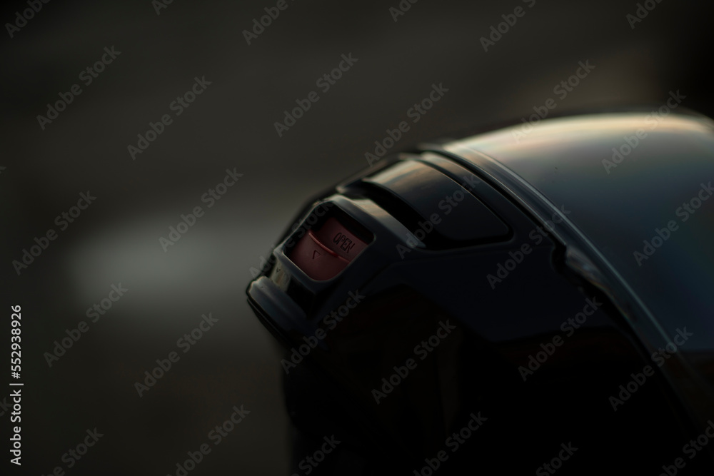 Motorcyclist's helmet is black. Biker head protection. Motorcyclist's helmet is black. Biker head protection.