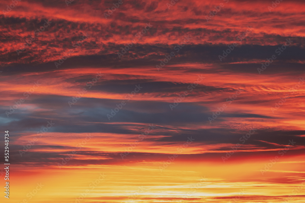 Abstract Saturated Orange-yellow Colors Of Clouds. Unusual Sky Background. Rich Orange Colors. Toned Pink-yellow Clouds. Sky Sunset Sunrise Background. Cloudy Sky. Sunny Cloudscape.