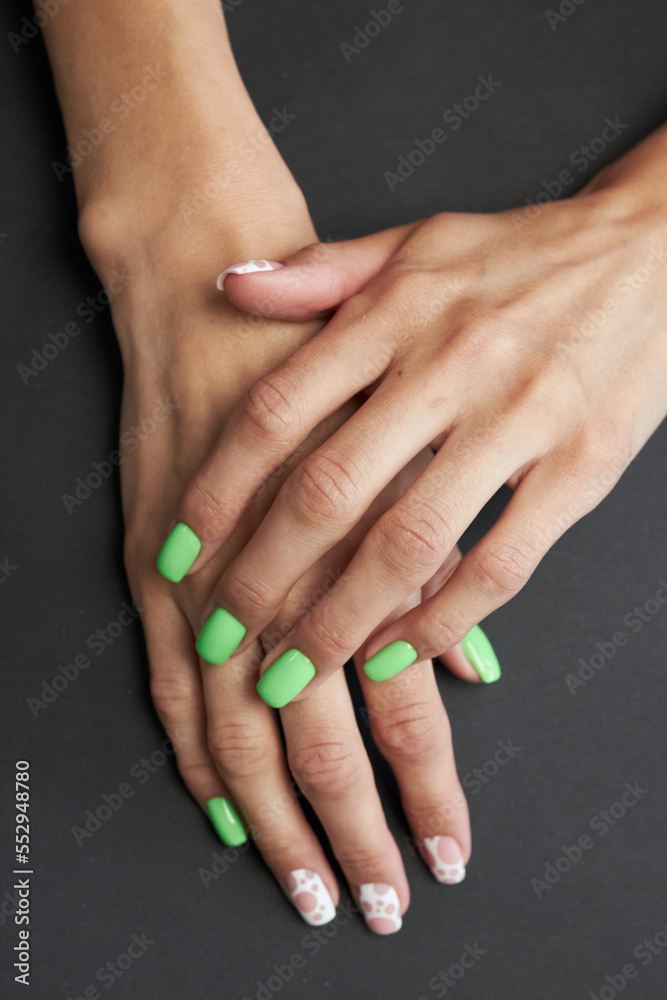 female manicure on a black background. nail. nails. Women's hands with a beautiful manicure on a black background. Beautiful female hands on a dark background. Take care of your hand. female manicure on a black background. nail. nails. Women's hands with a beautiful manicure on a black background. Beautiful female hands on a dark background. Take care of your hand.