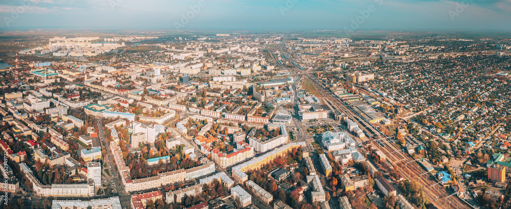 Aerial view of Homiel cityscape in autumn day. Bird's-eye view of railway station building and residential district. Gomel, Belarus. Panorama, panoramic view.
