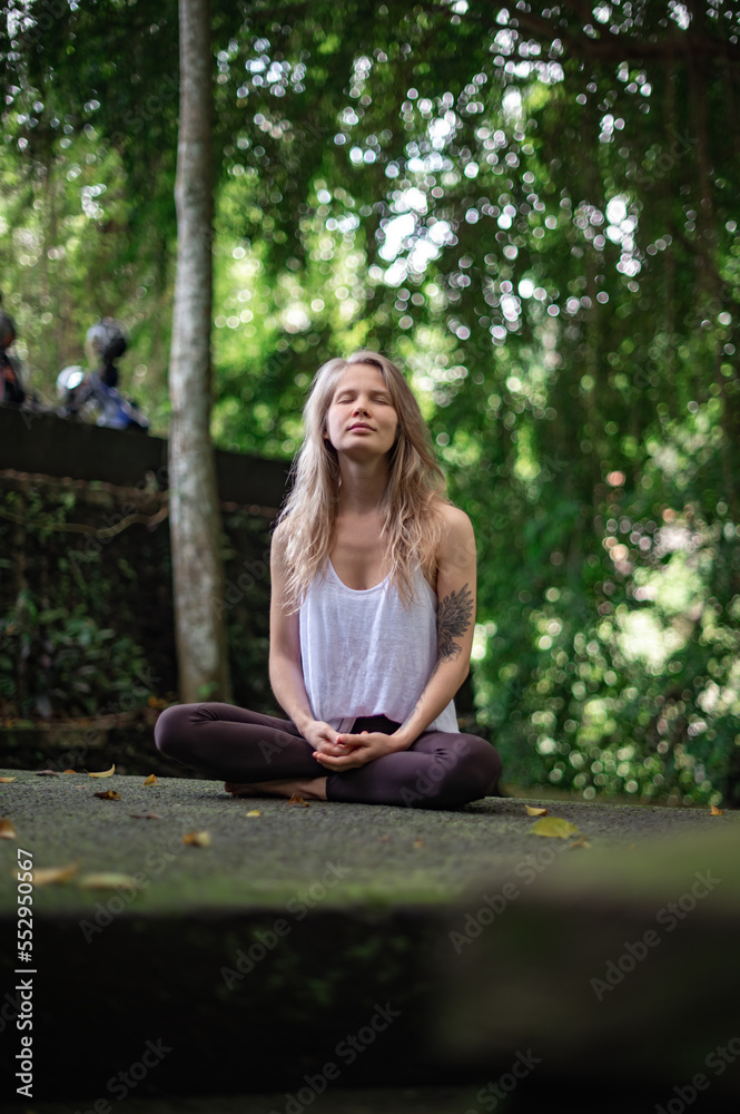 Girl practice yoga meditation outdoor in park