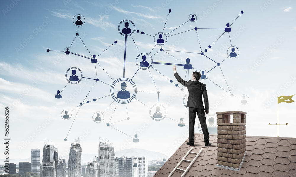 Businessman on house roof presenting networking and connection c