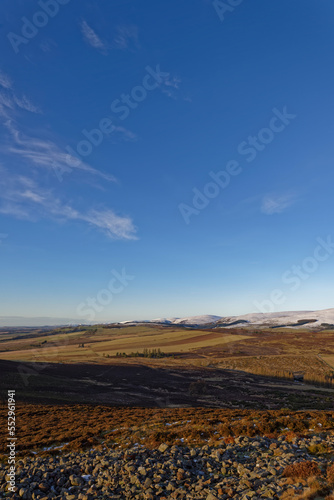 Looking Northwest down the Strathmore Valley from the White Caterthun Iron Age hill Fort with snow on the high peaks of the Angus Glens.