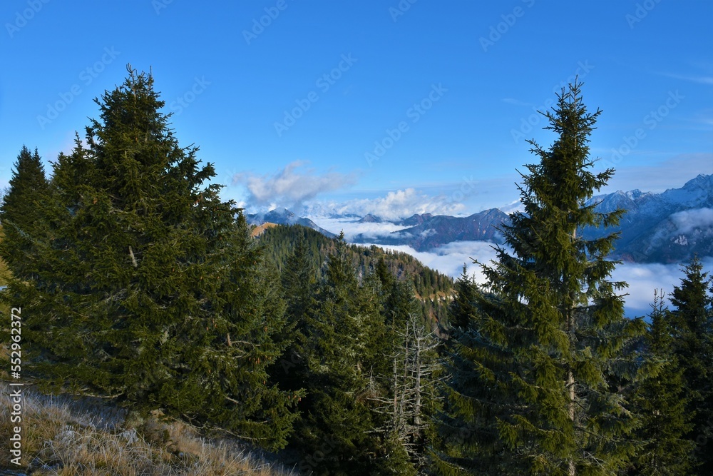 View of Jezersko basin and Kokra valley covered in fog and surrounding mountains in Gorenjska, Slovenia View of Jezersko basin and Kokra valley covered in fog and surrounding mountains in Gorenjska, Slovenia
