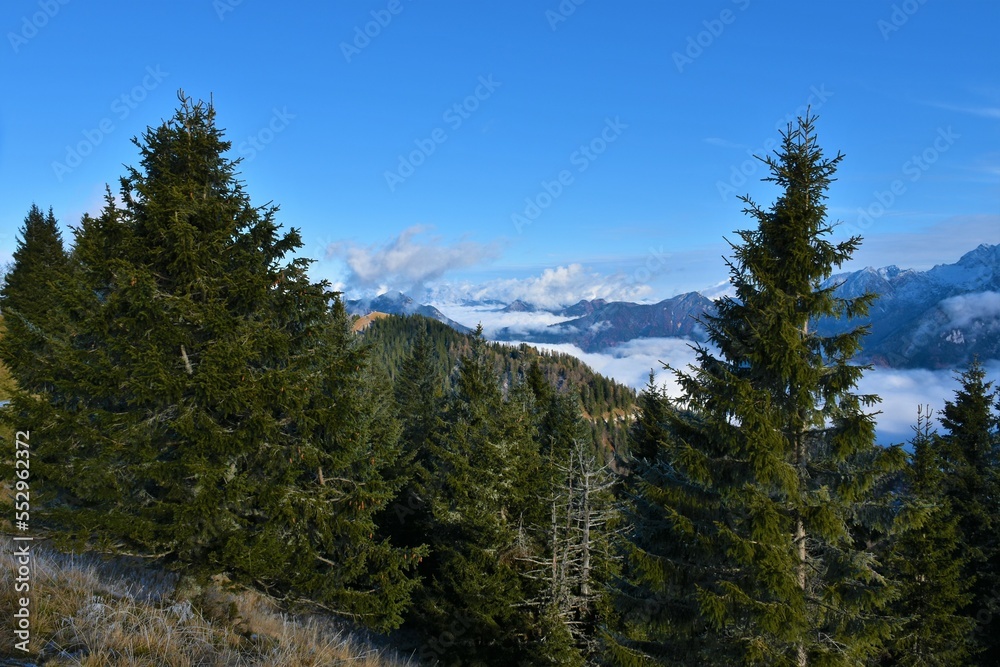 View of Jezersko basin and Kokra valley covered in fog and surrounding mountains in Gorenjska, Slovenia