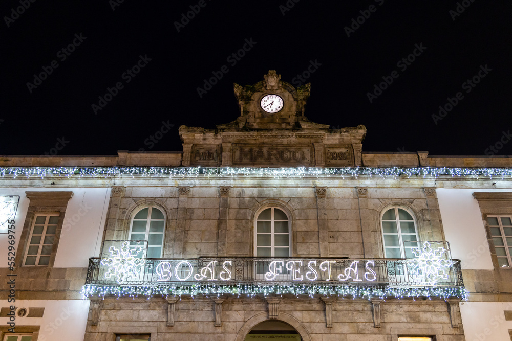 Obraz premium Vigo, Spain - December 05, 2022: Christmas lights decoration, with tourists walking through its streets in the city of Vigo, Pontevedra, Spain