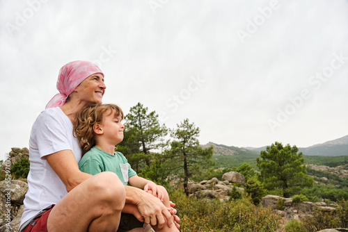 Woman with cancer enjoying nature with her son