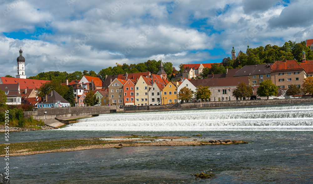 Obraz premium River view on Landberg-am-Lech town, Germany on a cloudy autumn day