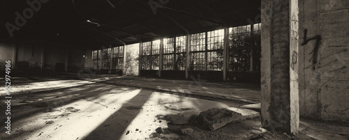 Old abandoned factory building or warehouse on sunny summer day	