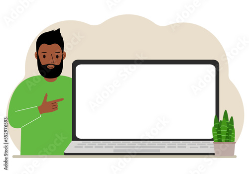 A man next to a large laptop with plenty of space for text.