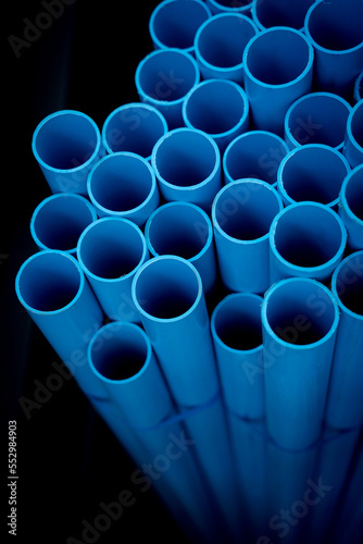 Background of the blue plastic pipes in stacked