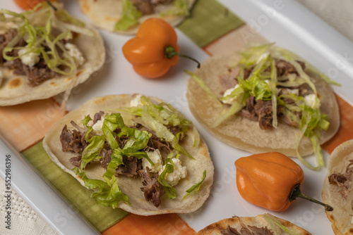 Extreme close up of Chalupas, Typical Mexican food on platter. photo