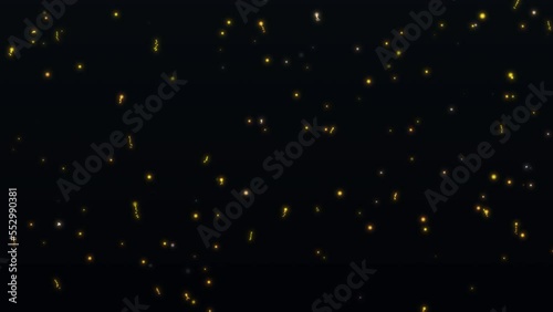 Flying particles on a black background. Twinkling stardust. Macro photography in slow motion. Animation in 4K format.