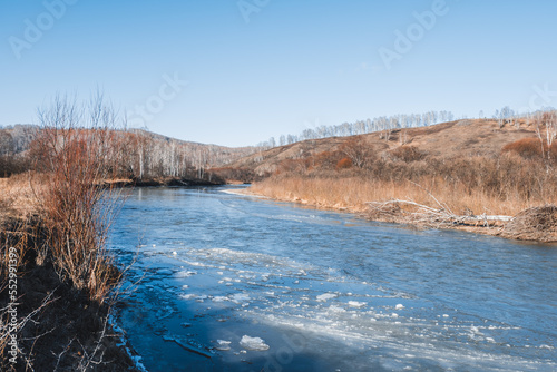 beautiful sunny morning on a freezing river in siberia
