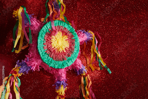 Mexican Pinata used in posadas and birthdays on red background photo