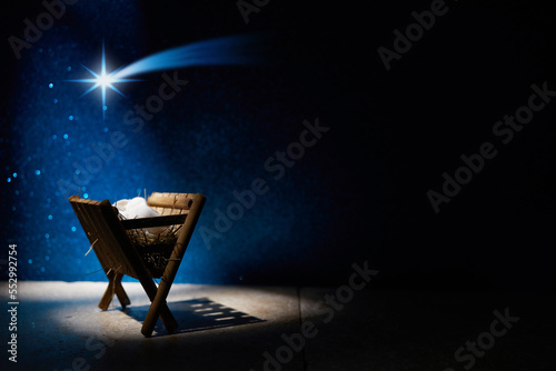 Nativity of Jesus, empty manger at night with bright lights. Fototapet