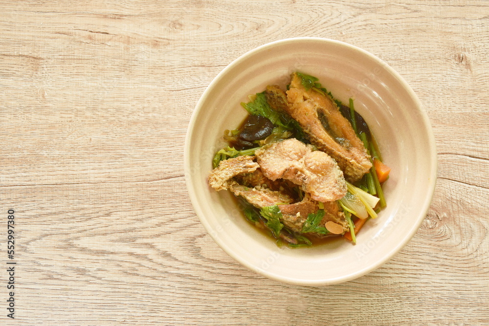 deep fried slice striped snake head fish with ginger and celery on bowl deep fried slice striped snake head fish with ginger and celery on bowl