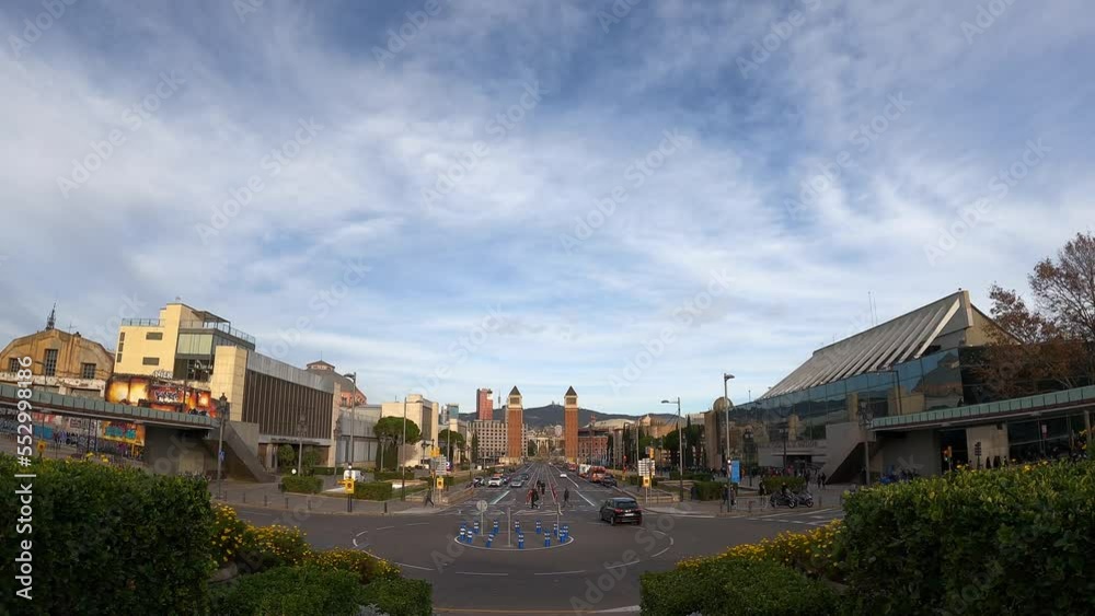 Timelapse of roundabout with traffic and flowers foreground in city. Transportation, road concept Timelapse of roundabout with traffic and flowers foreground in city. Transportation, road concept