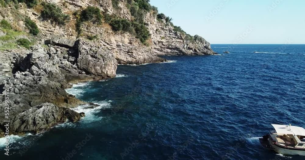 Aerial Close Up of Mediterranean sea. Cinematic wild nature, tourist destination on the Amalfi Coast, Italy. Transparent blue sea waters. Beautiful coastline with turquoise water. Aerial Close Up of Mediterranean sea. Cinematic wild nature, tourist destination on the Amalfi Coast, Italy. Transparent blue sea waters. Beautiful coastline with turquoise water.