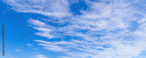 Blue sky with white clouds on a daytime. Panoramic background