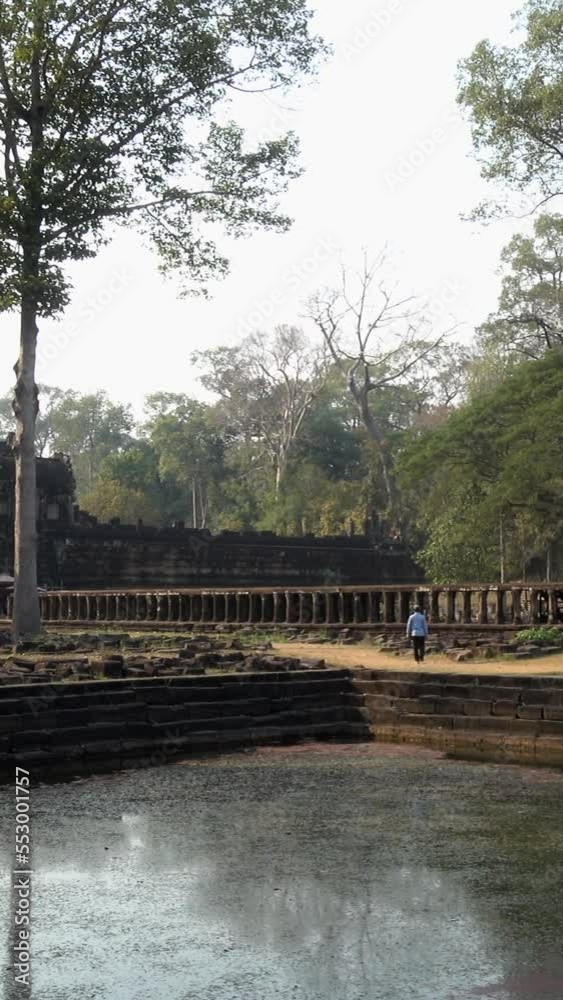 Baphuon Temple with its water ponds in Angkor Wat Baphuon Temple with its water ponds in Angkor Wat