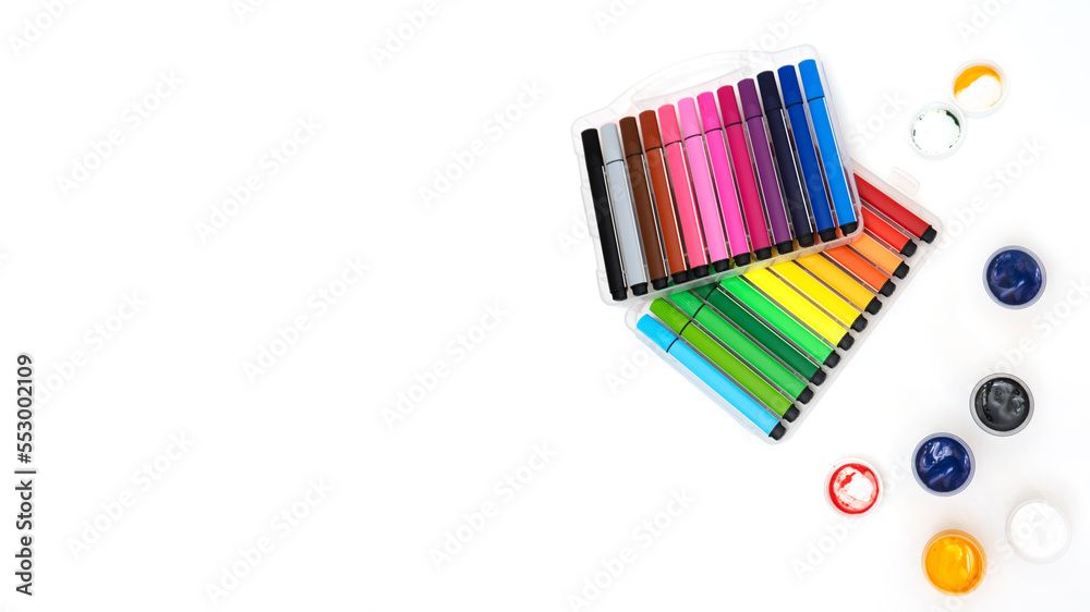 Gouache paints, markers and children's drawing. Painting concept. Top view. Copy space. Gouache paints, markers and children's drawing. Painting concept. Top view. Copy space.