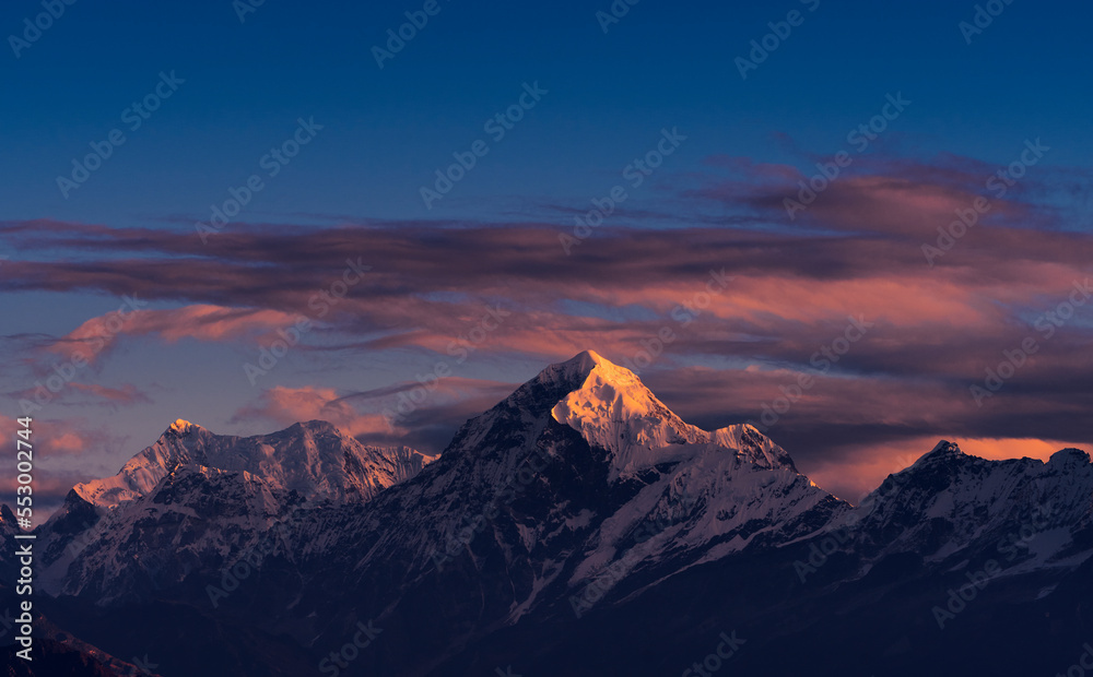 First ray of morning sun on the majestic Kangchenjunga range (third highest in the World) of Himalayas. The highlighted peak is Mt. Siniolchu (6,888 metres) in centre. Photo taken from Sandakphu, WB.