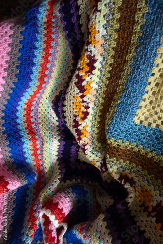 Close Up of a Multicolour Crochet Knitted Blnket in Vintage Design photo