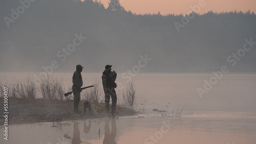hunting by the creek in the forest. And hunting birds. Hunter hunting at sunrise