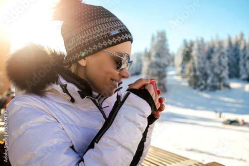 Outdoor portrait of adorable woman in winter clothes