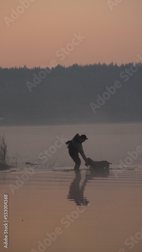 hunting by the creek in the forest. And hunting birds. Hunter hunting at sunrise