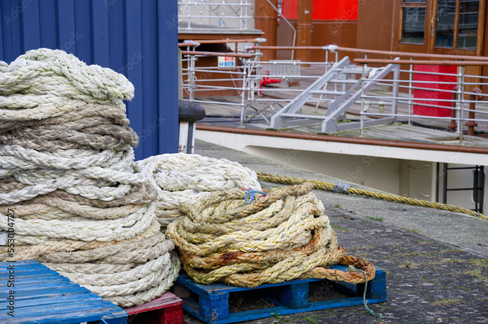 Ship rope in roll at harbour for secure mooring of boat