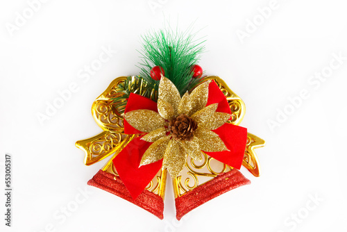 Christmas tree decoration, red and gold bells with ribbon bows, isolated on white