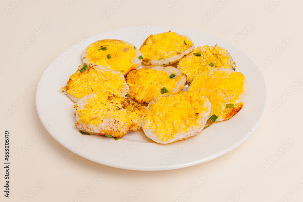 Banh can, Vietnamese mini pancake with with rice batter and egg, vietnamese food isolated on white background, close-up Banh can, Vietnamese mini pancake with with rice batter and egg, vietnamese food isolated on white background, close-up