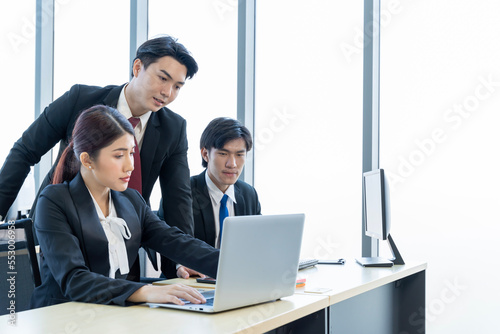 A group of young Asian businessmen Talking and planning work happily and have fun. at the company's office