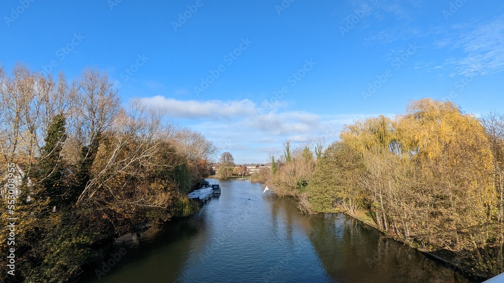 autumn landscape with river, trees stand both size of river autumn landscape with river, trees stand both size of river