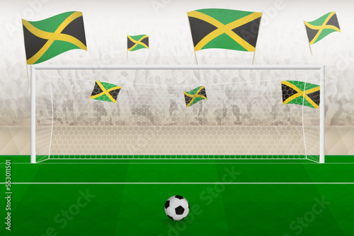 Jamaica football team fans with flags of Jamaica cheering on stadium, penalty kick concept in a soccer match.