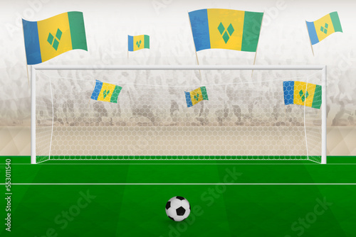 Saint Vincent and the Grenadines football team fans with flags of Saint Vincent and the Grenadines cheering on stadium, penalty kick concept in a soccer match.