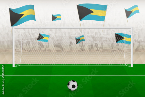 The Bahamas football team fans with flags of The Bahamas cheering on stadium, penalty kick concept in a soccer match.
