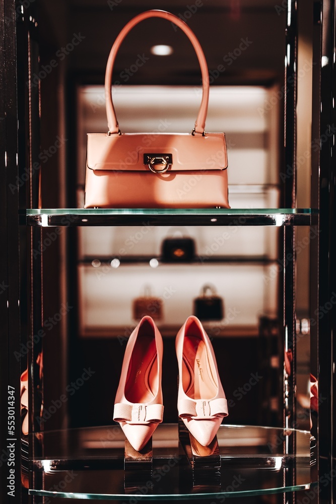 Salvatore Ferragamo luxury fashionable female pink shoes and handbag on  display for sale Stock Photo | Adobe Stock