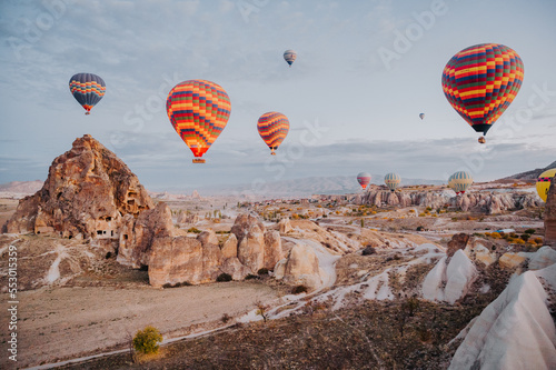 Hot Air Balloons over famous tourist destination Cappadocia UNESCO, Turkey