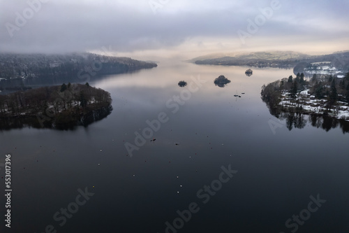 Lake Windermere,  Lake District in England in winter with snow on the ground. Aerial drone above view. © Sam Foster